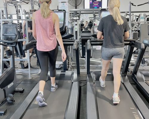 girls walking on treadmills