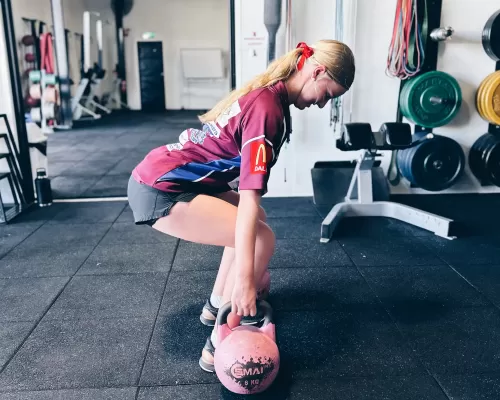 a girl lifting weights