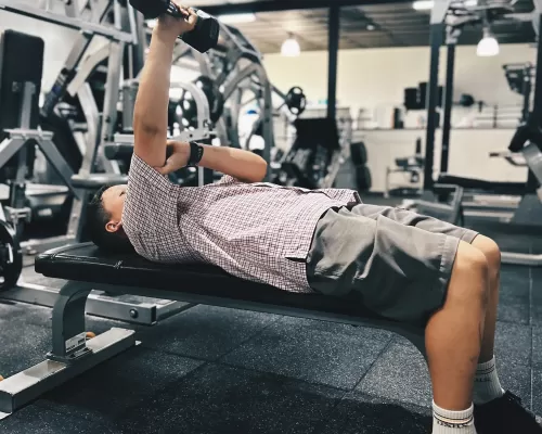 a-boy-doing-dumbbell-chest-press-workout