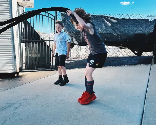 a kid doing his rope exercise