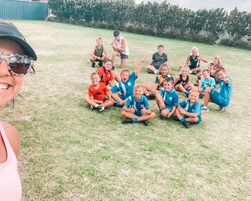 kids sitting on the grass