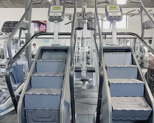 two stair climber equipment inside a gym