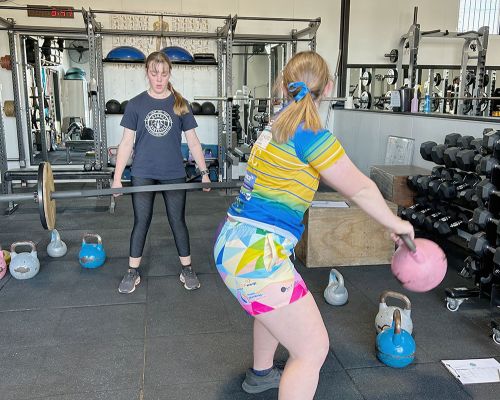 teen girls doing gym exercises