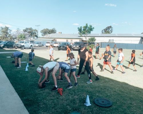 kids and coach playing