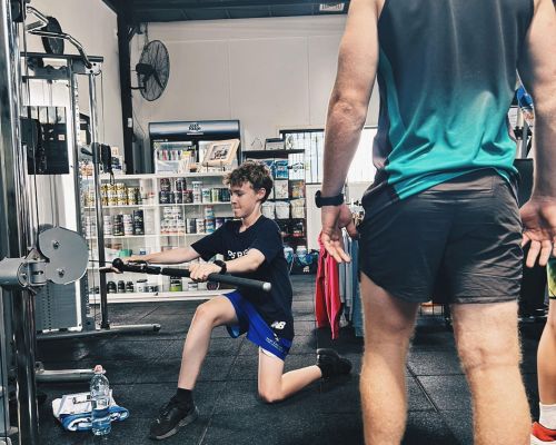 boy-doing-squat-lifts