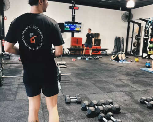 a man with his dumbbells on the floor
