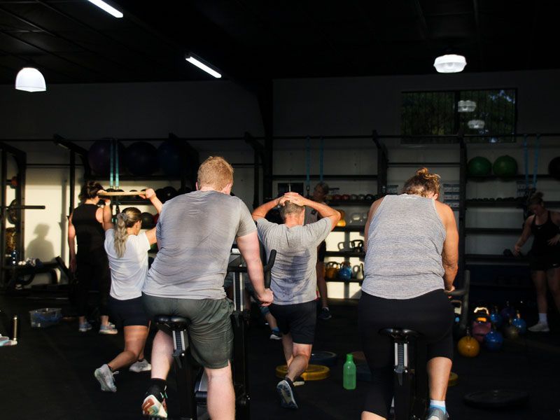 Gym participants doing cardio exercises 